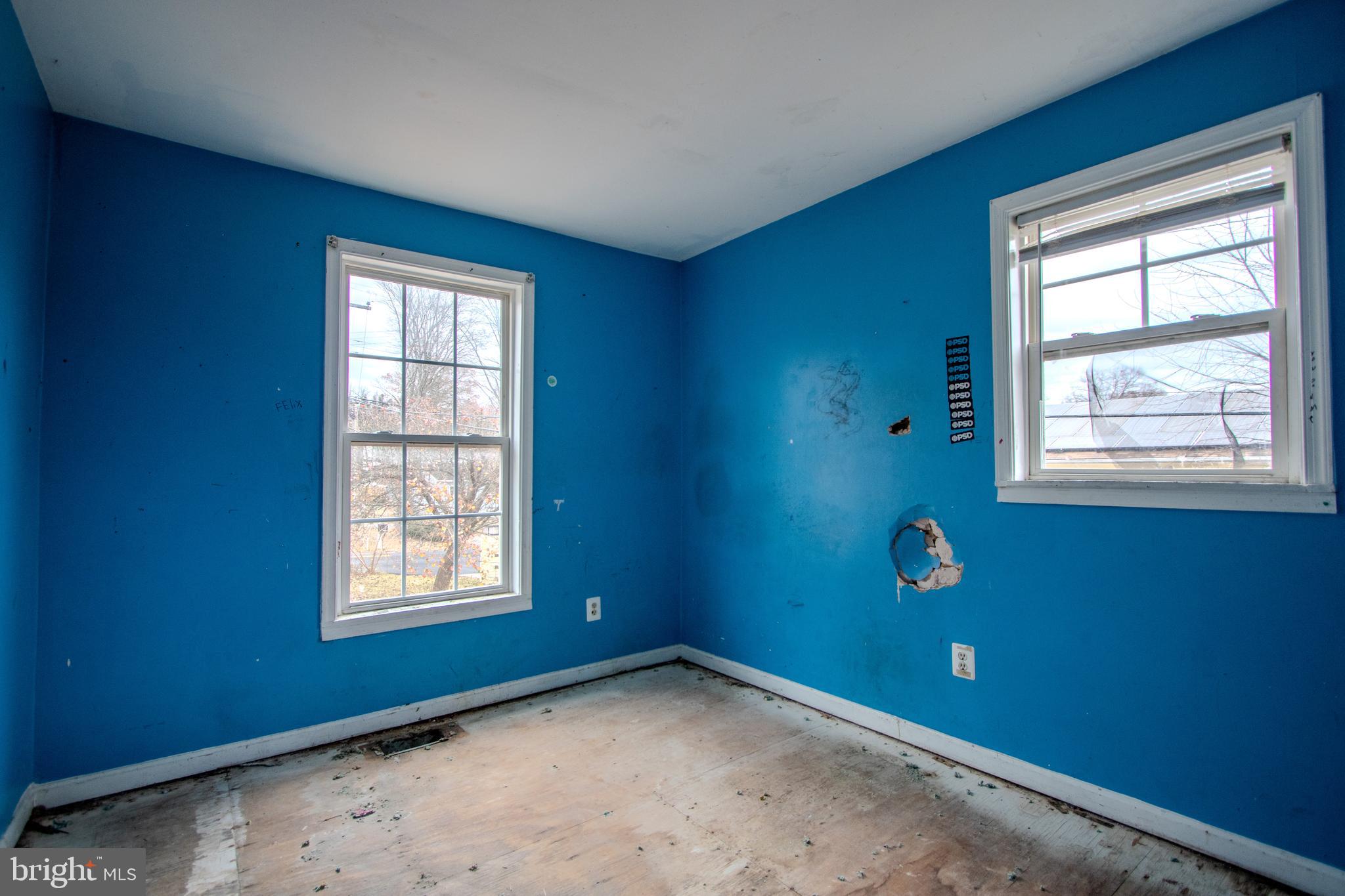 12707 Duckettown Road Laurel, MD 20708 - Photo 12 of 21 an empty room with windows