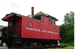 12707 Duckettown Road Laurel, MD 20708 - Photo 18 of 21 a sign on the side of a road