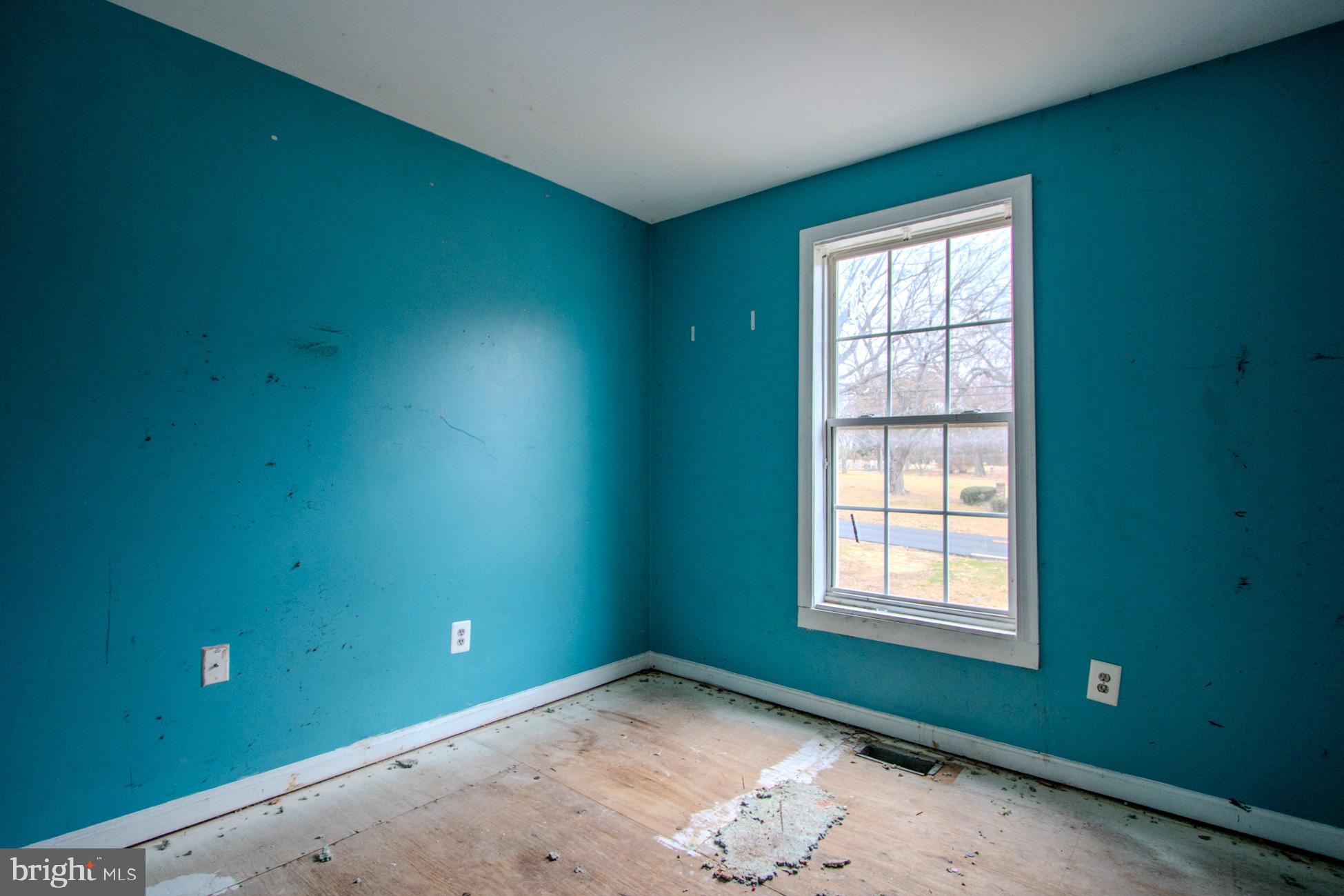 12707 Duckettown Road Laurel, MD 20708 - Photo 9 of 21 an empty room with windows