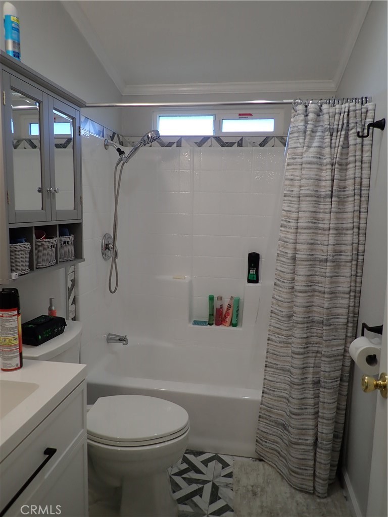 27250 Murrieta Road, Unit 386 Menifee, CA 92586 - Photo 14 of 32 a bathroom with a sink a toilet and shower