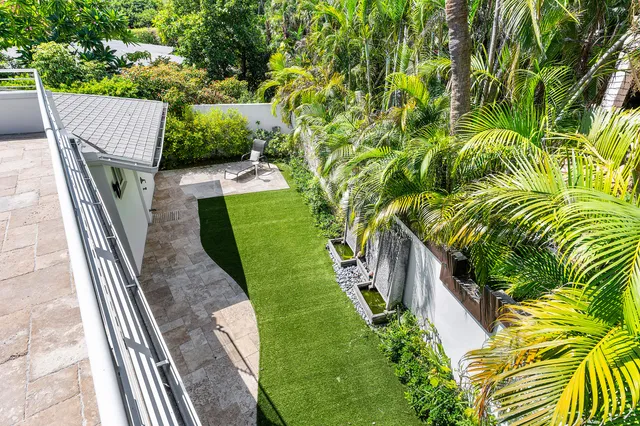 an aerial view of residential building and lake