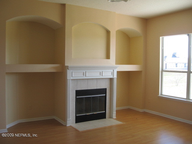 221 Porta Rosa Circle St. Augustine, FL 32092 - Photo 3 of 17 a view of an empty room with window and wooden floor