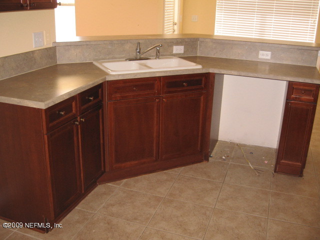 221 Porta Rosa Circle St. Augustine, FL 32092 - Photo 4 of 17 a bathroom with a sink and a mirror