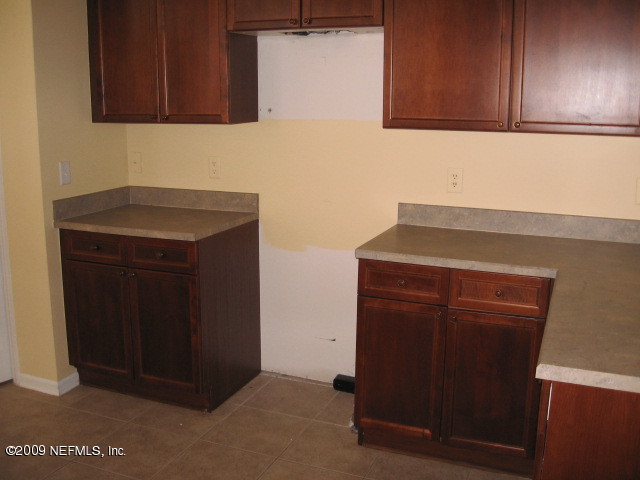 221 Porta Rosa Circle St. Augustine, FL 32092 - Photo 6 of 17 a kitchen with a sink and cabinets