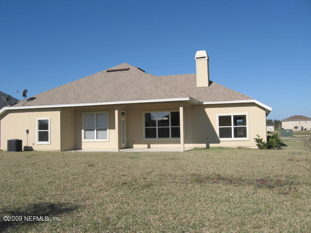 221 Porta Rosa Circle St. Augustine, FL 32092 - Photo 10 of 17 a front view of a house with yard