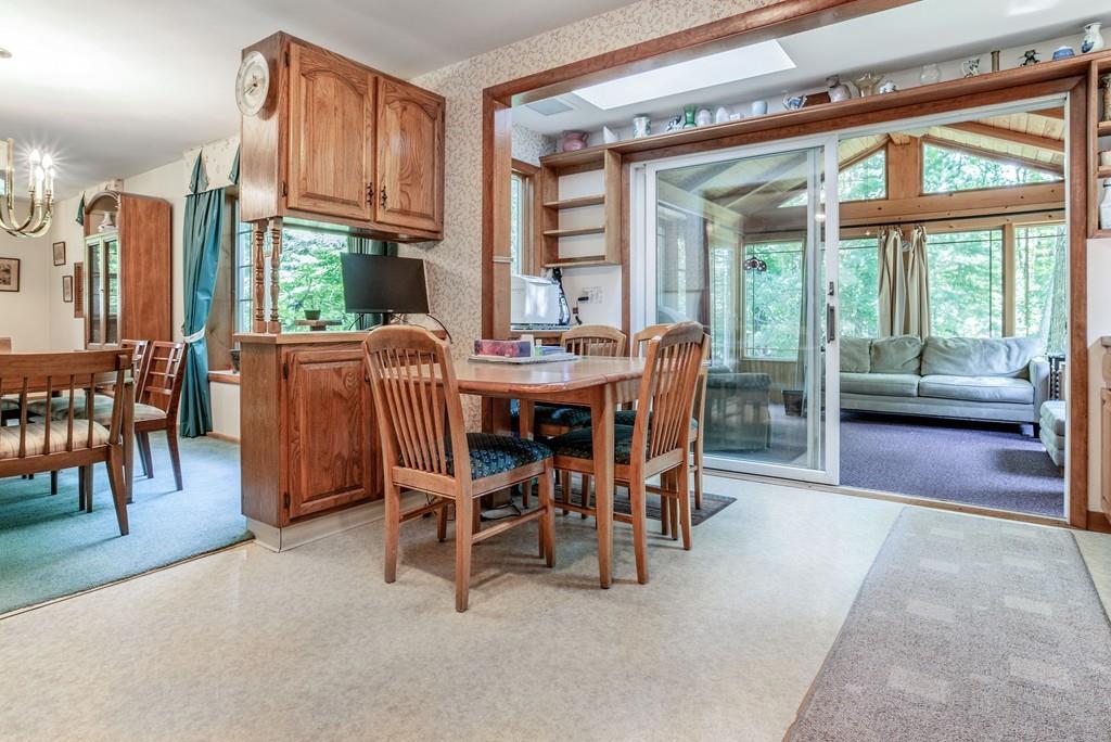 61 Hickory Road Sudbury, MA 01776 - Photo 11 of 29 a view of a dining room with furniture window and outside view