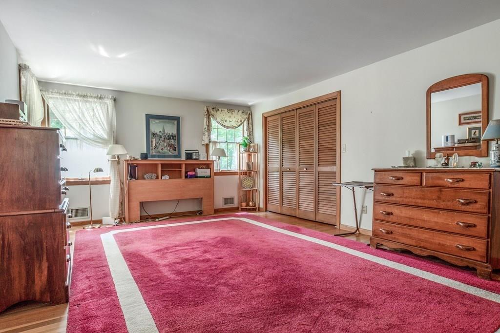 61 Hickory Road Sudbury, MA 01776 - Photo 20 of 29 a view of a bedroom with furniture and windows
