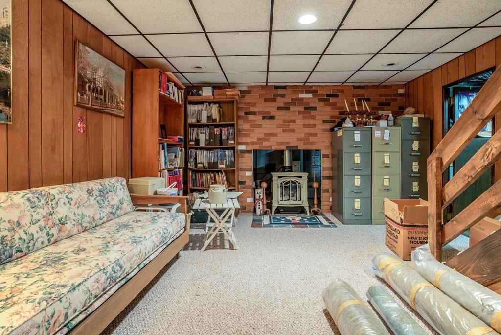 61 Hickory Road Sudbury, MA 01776 - Photo 24 of 29 a living room with furniture a couch and a ceiling fan
