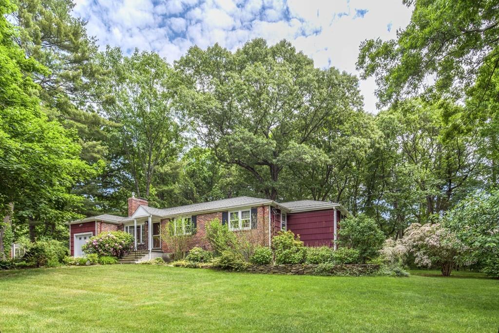 61 Hickory Road Sudbury, MA 01776 - Photo 26 of 29 a front view of a house with a garden and trees