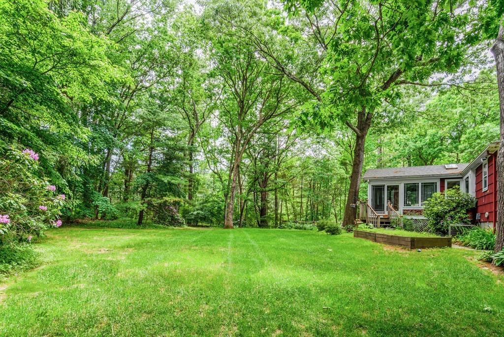 61 Hickory Road Sudbury, MA 01776 - Photo 28 of 29 a view of a house with backyard and sitting area