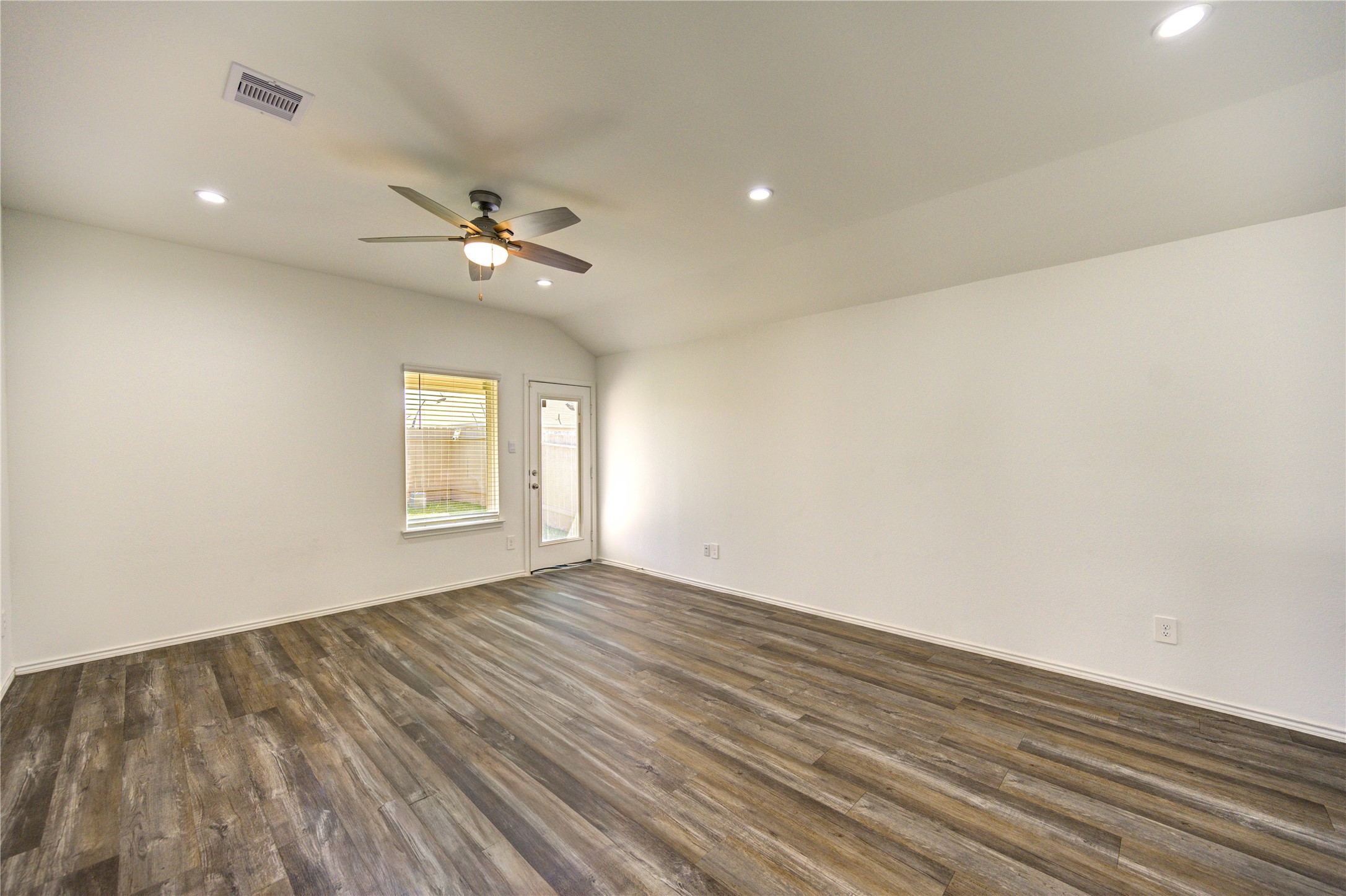 5406 Castlebury Meadows Dr Spring Spring, TX 77373 - Photo 14 of 34 wooden floor in an empty room with a window