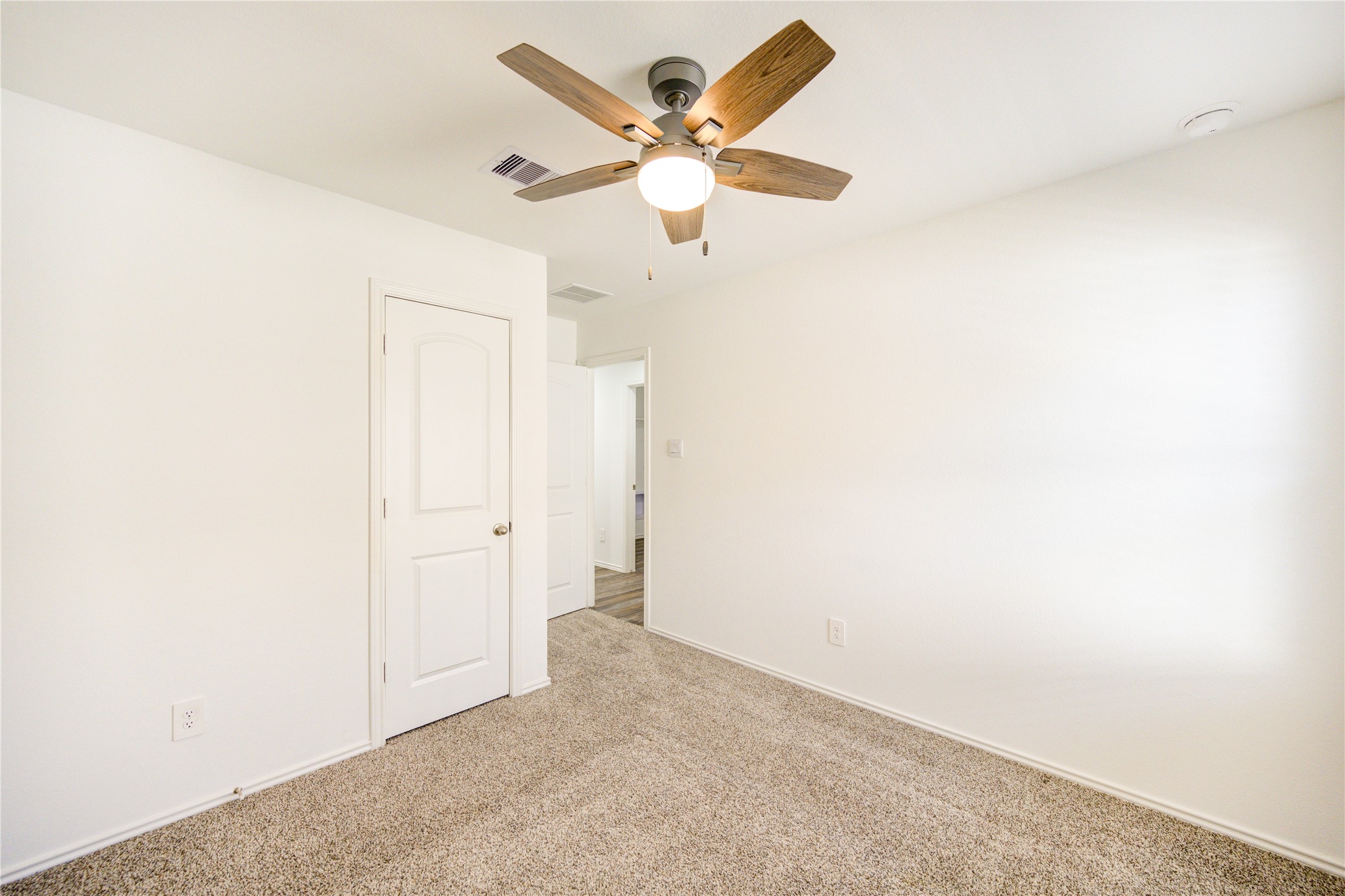 5406 Castlebury Meadows Dr Spring Spring, TX 77373 - Photo 15 of 34 an empty room with closet and ceiling fan