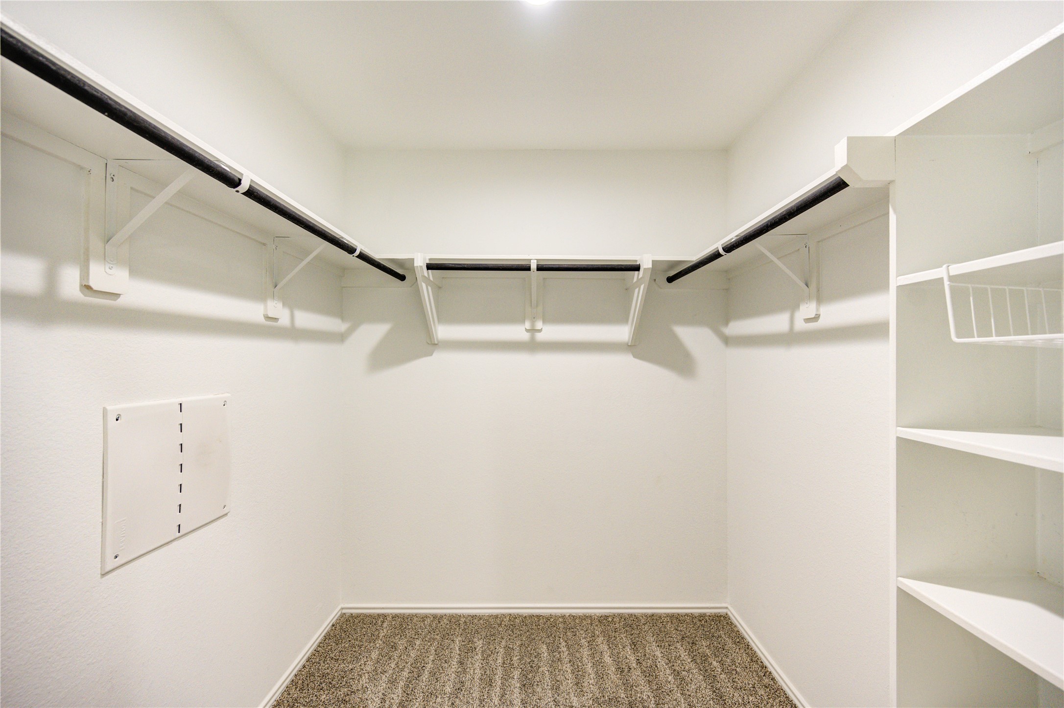 5406 Castlebury Meadows Dr Spring Spring, TX 77373 - Photo 19 of 34 a view of walk in closet with empty racks