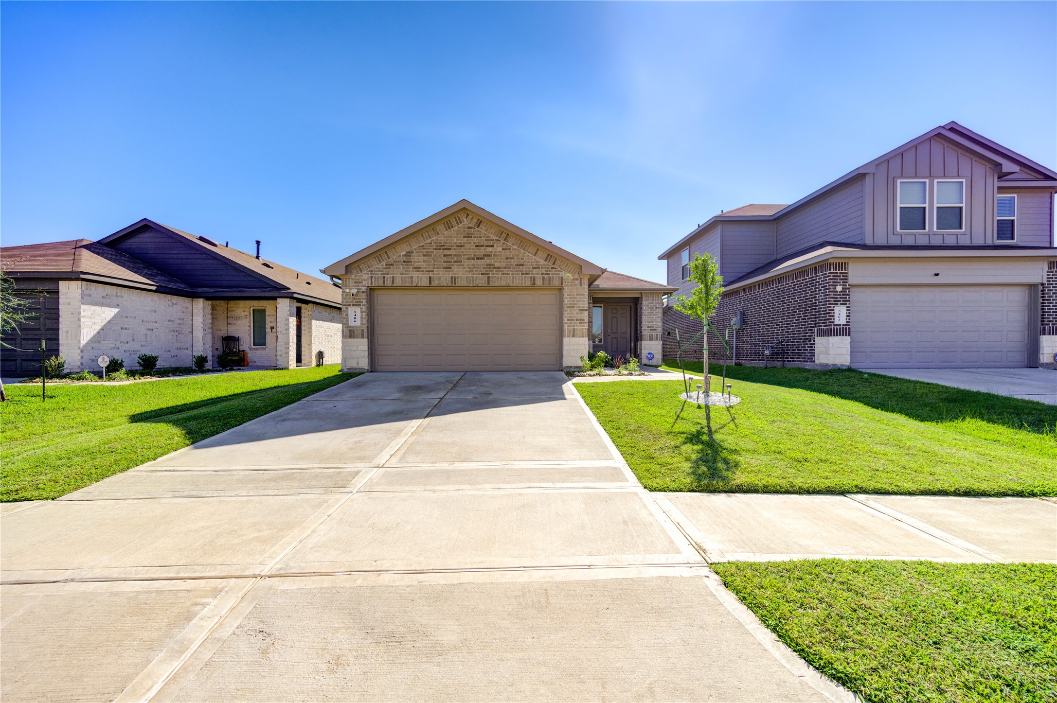 5406 Castlebury Meadows Dr Spring Spring, TX 77373 - Photo 2 of 34 a front view of a house with a yard and garage
