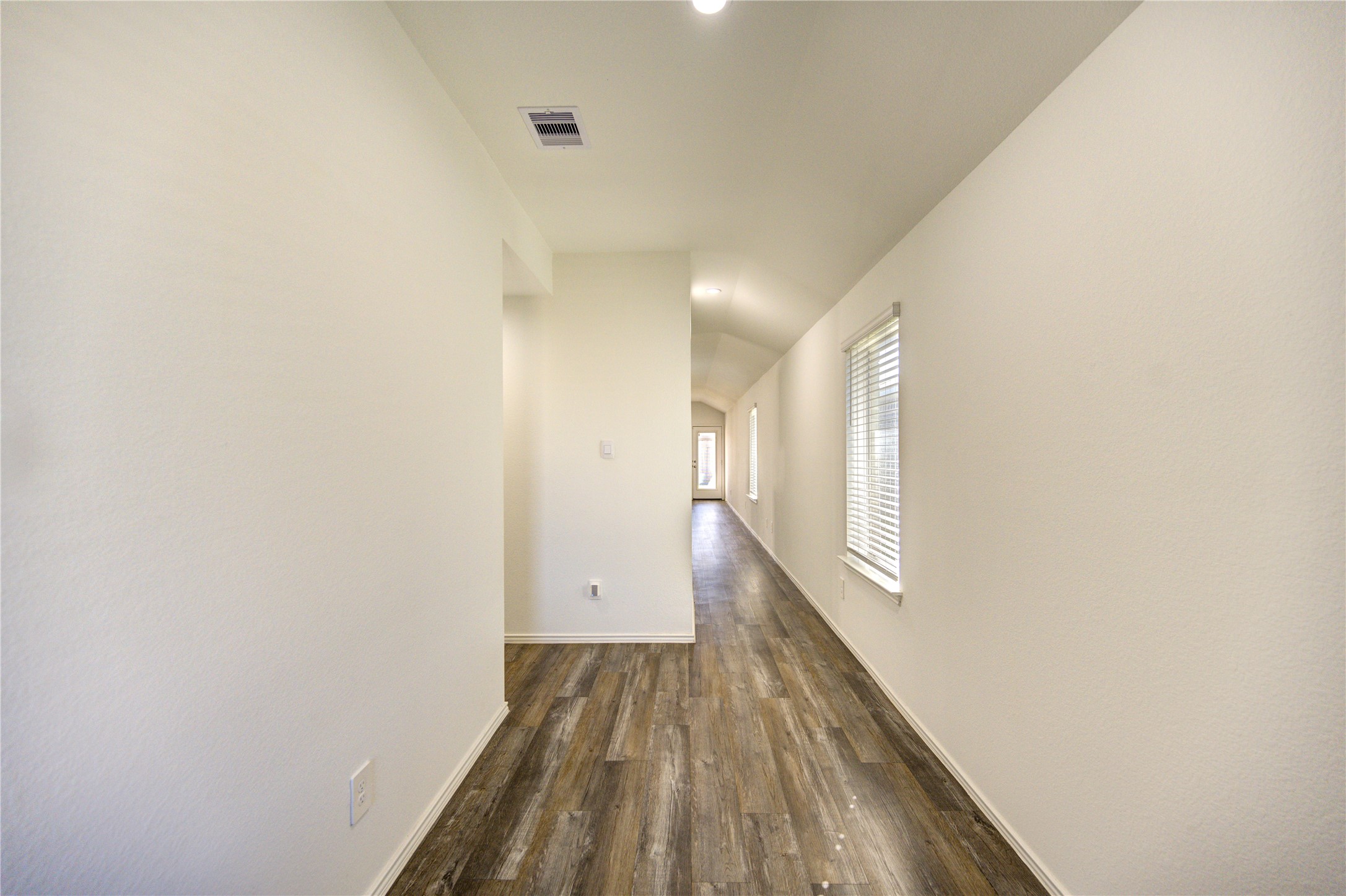 5406 Castlebury Meadows Dr Spring Spring, TX 77373 - Photo 4 of 34 a view of a hallway with wooden floor