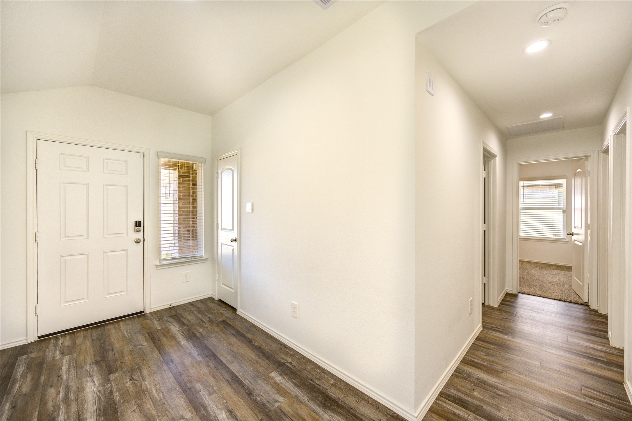 5406 Castlebury Meadows Dr Spring Spring, TX 77373 - Photo 5 of 34 a view of a hallway with wooden floor