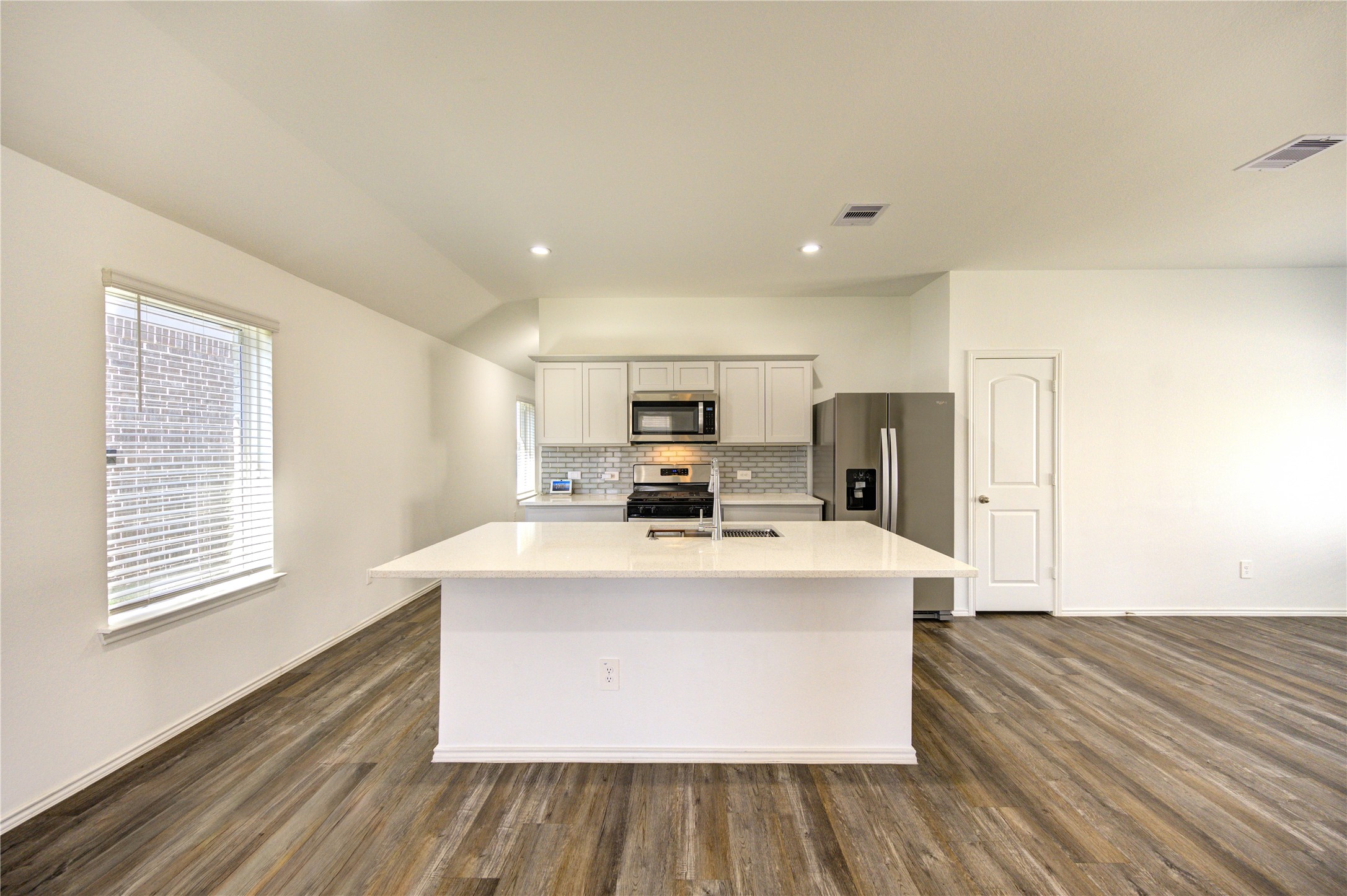 5406 Castlebury Meadows Dr Spring Spring, TX 77373 - Photo 8 of 34 a view of kitchen with stainless steel appliances wooden floor and large window