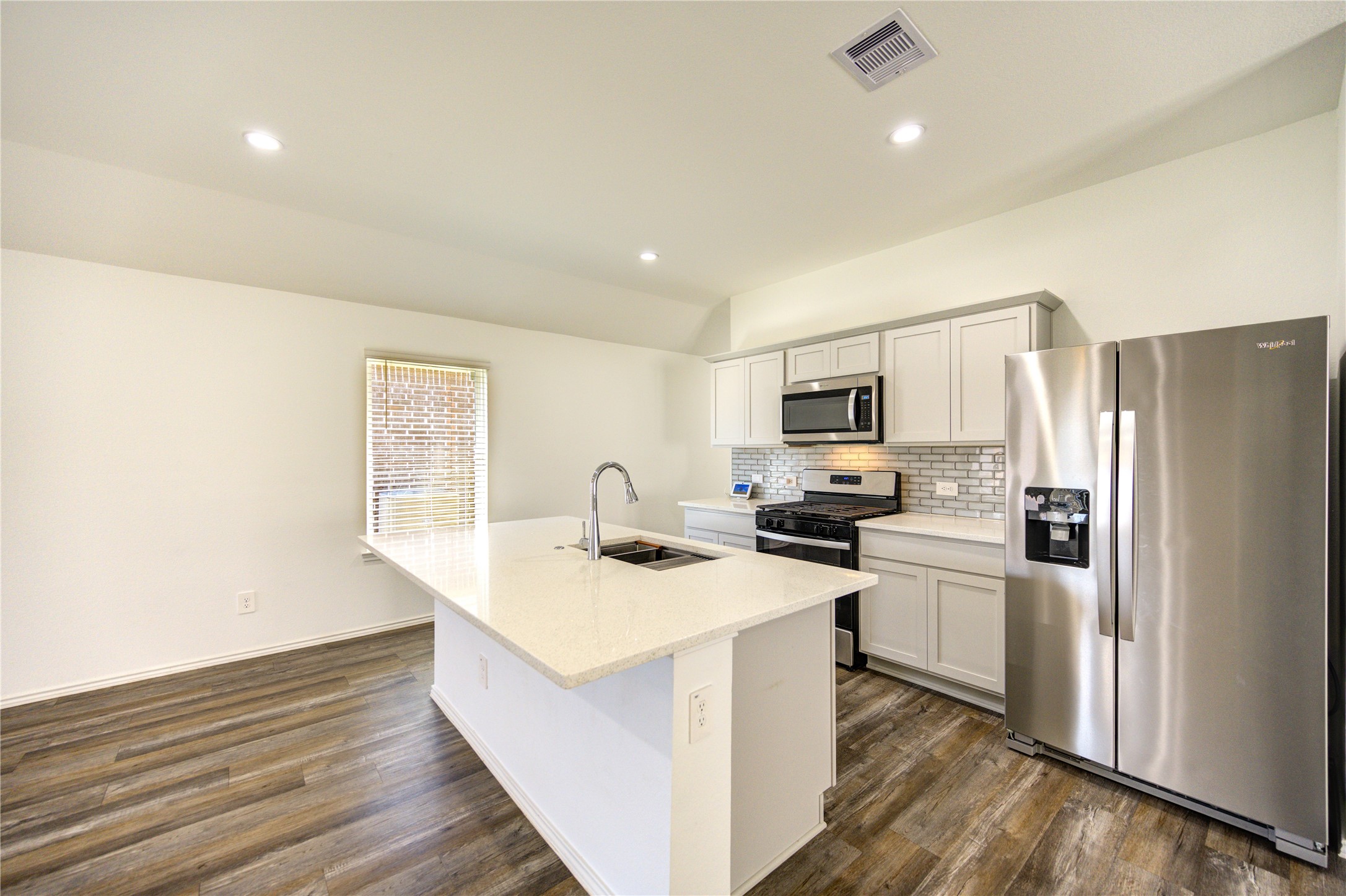 5406 Castlebury Meadows Dr Spring Spring, TX 77373 - Photo 10 of 34 a kitchen with stainless steel appliances granite countertop a sink stove and refrigerator
