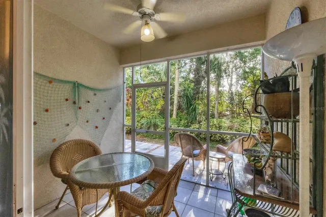a dining room with furniture garden view and a chandelier