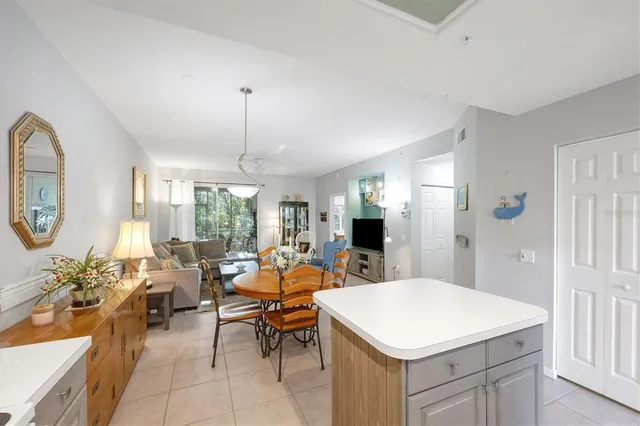 a living room with furniture a window and a dining table