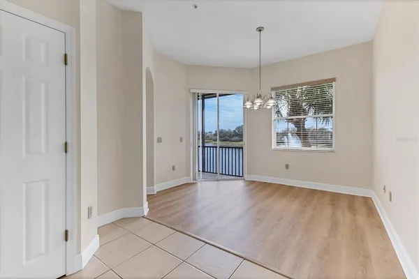 an empty room with windows and entrance