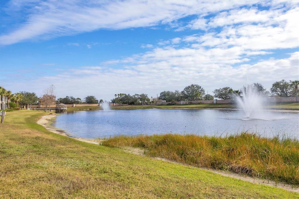 8411 Miramar Way, Unit 202 Lakewood Ranch, FL 34202 - Photo 29 of 37 a view of a lake with houses in the back
