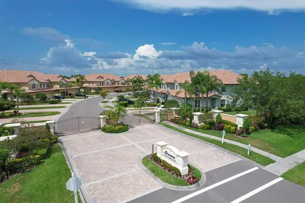 an aerial view of a house with a garden and a yard