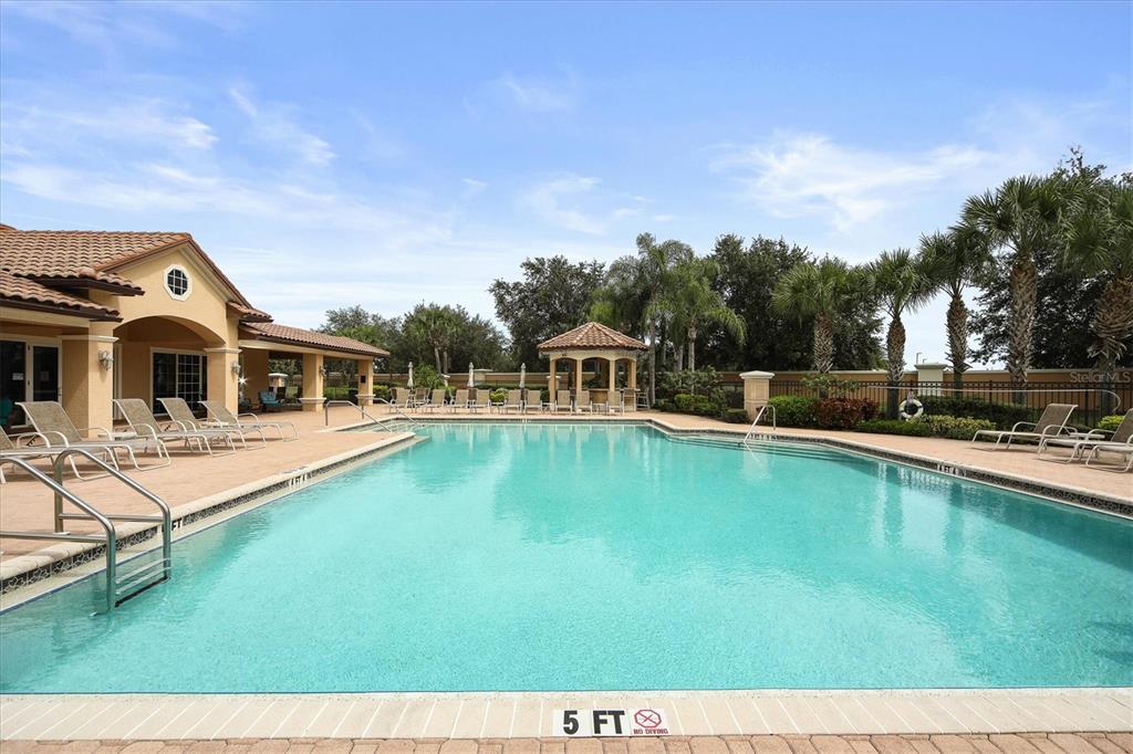 8411 Miramar Way, Unit 202 Lakewood Ranch, FL 34202 - Photo 33 of 37 a view of a house with swimming pool and sitting area