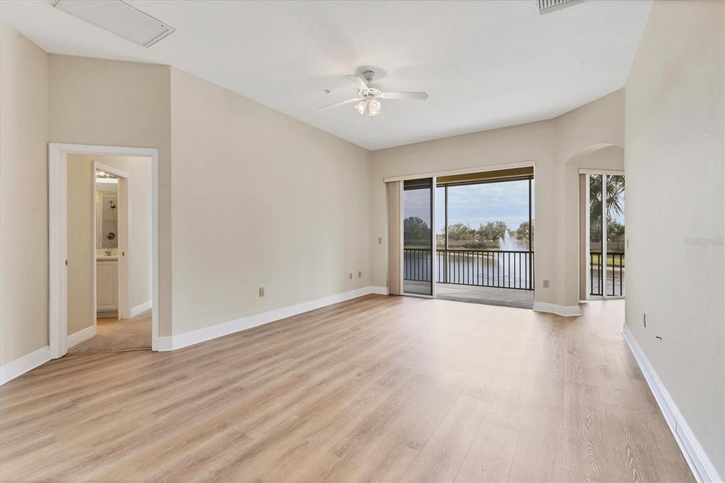 8411 Miramar Way, Unit 202 Lakewood Ranch, FL 34202 - Photo 6 of 37 wooden floor in an empty room with a window