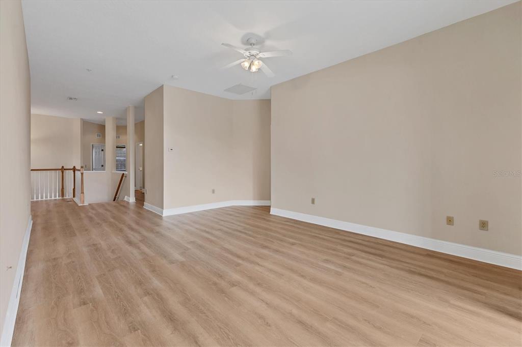 8411 Miramar Way, Unit 202 Lakewood Ranch, FL 34202 - Photo 8 of 37 a view of empty room with wooden floor