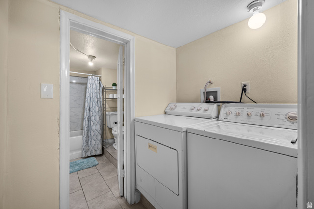 88 East C Street Springville, UT 84663 - Photo 26 of 32 Dedicated laundry area featuring a washer and dryer, with a bathroom beyond the doorway