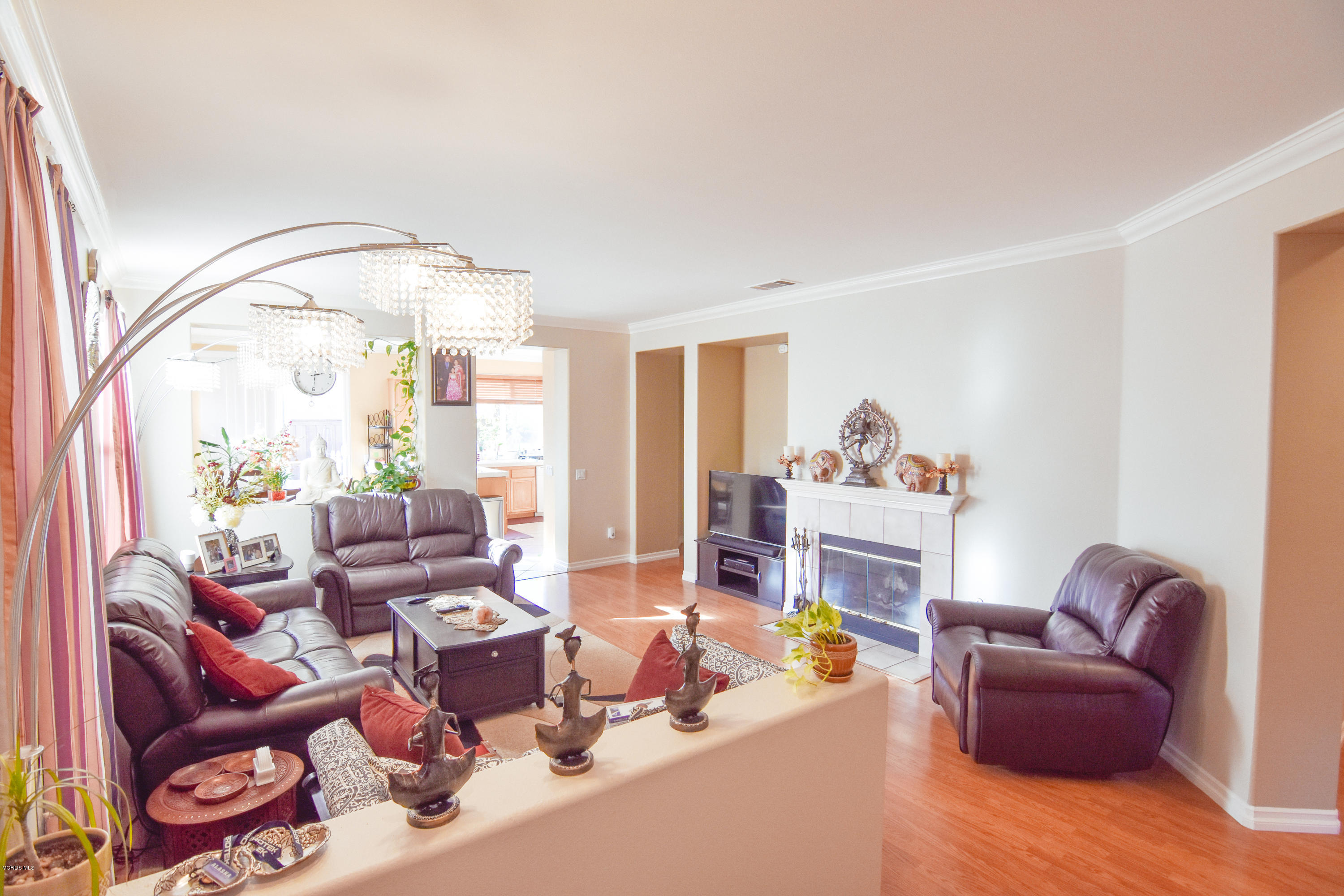 801 Fresca Drive Oxnard, CA 93030 - Photo 5 of 20 a living room with furniture fireplace and a large window
