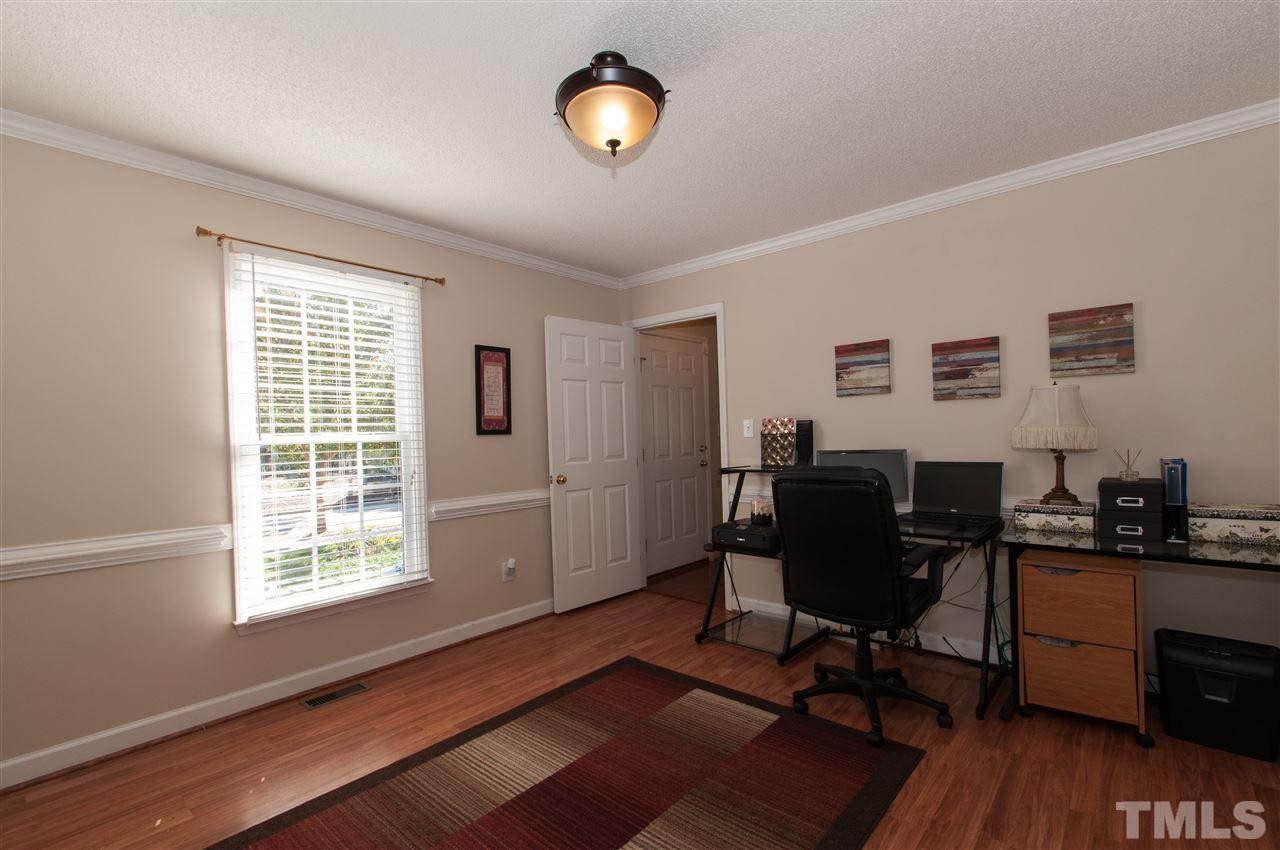 3205 Arden Branch Lane Raleigh, NC 27616 - Photo 11 of 22 a view of a workspace with furniture and a window