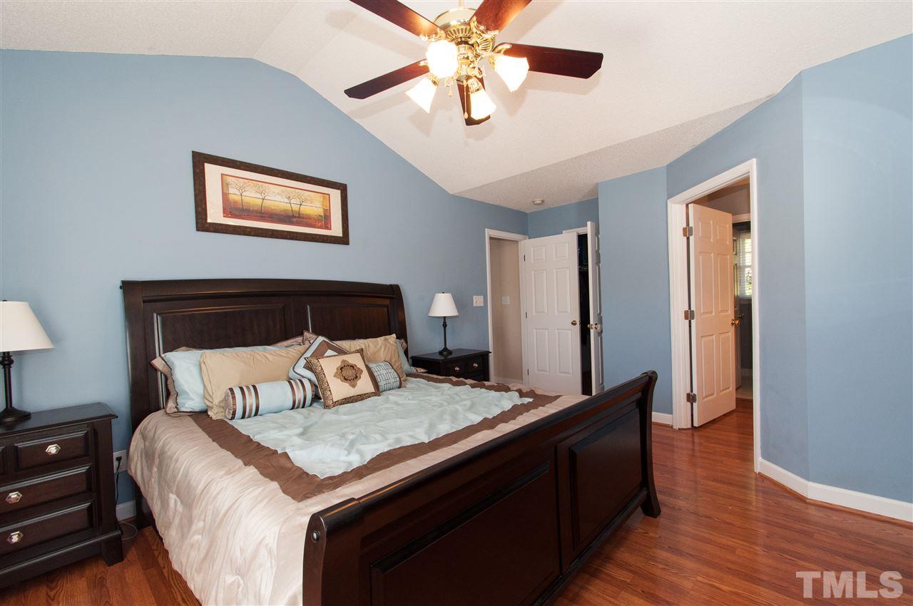 3205 Arden Branch Lane Raleigh, NC 27616 - Photo 12 of 22 a bedroom with a bed and wooden floor