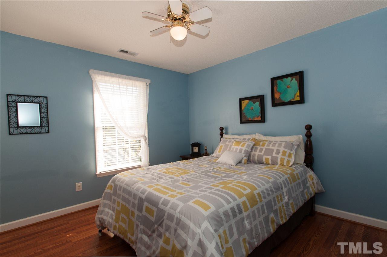 3205 Arden Branch Lane Raleigh, NC 27616 - Photo 16 of 22 a bedroom with a bed and a window