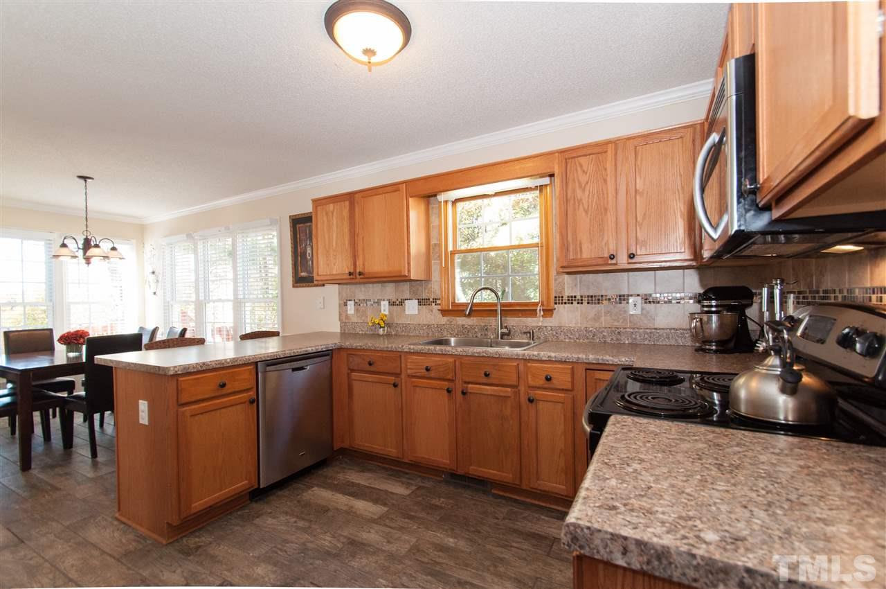 3205 Arden Branch Lane Raleigh, NC 27616 - Photo 6 of 22 a kitchen with lots of counter top space