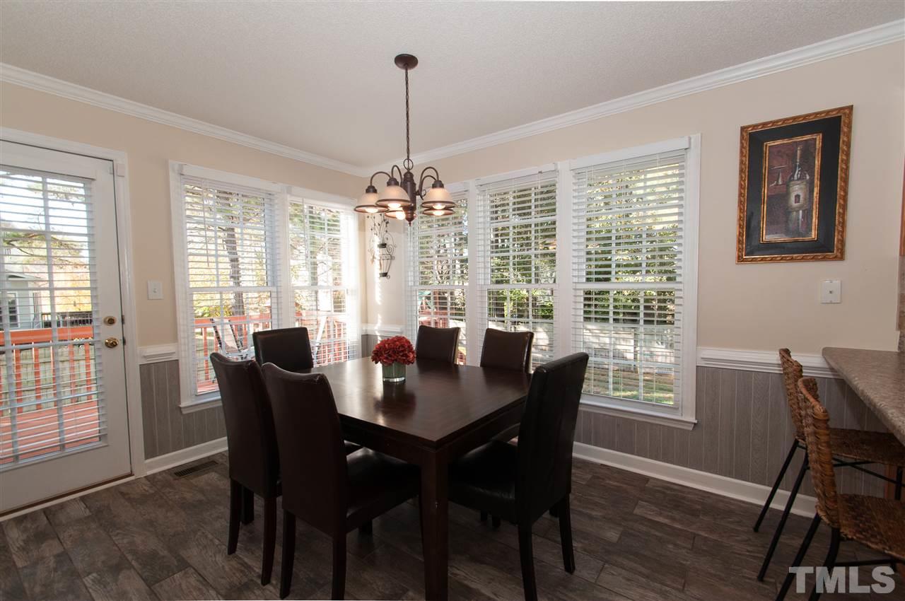 3205 Arden Branch Lane Raleigh, NC 27616 - Photo 8 of 22 a view of a dining room with furniture window and outside view