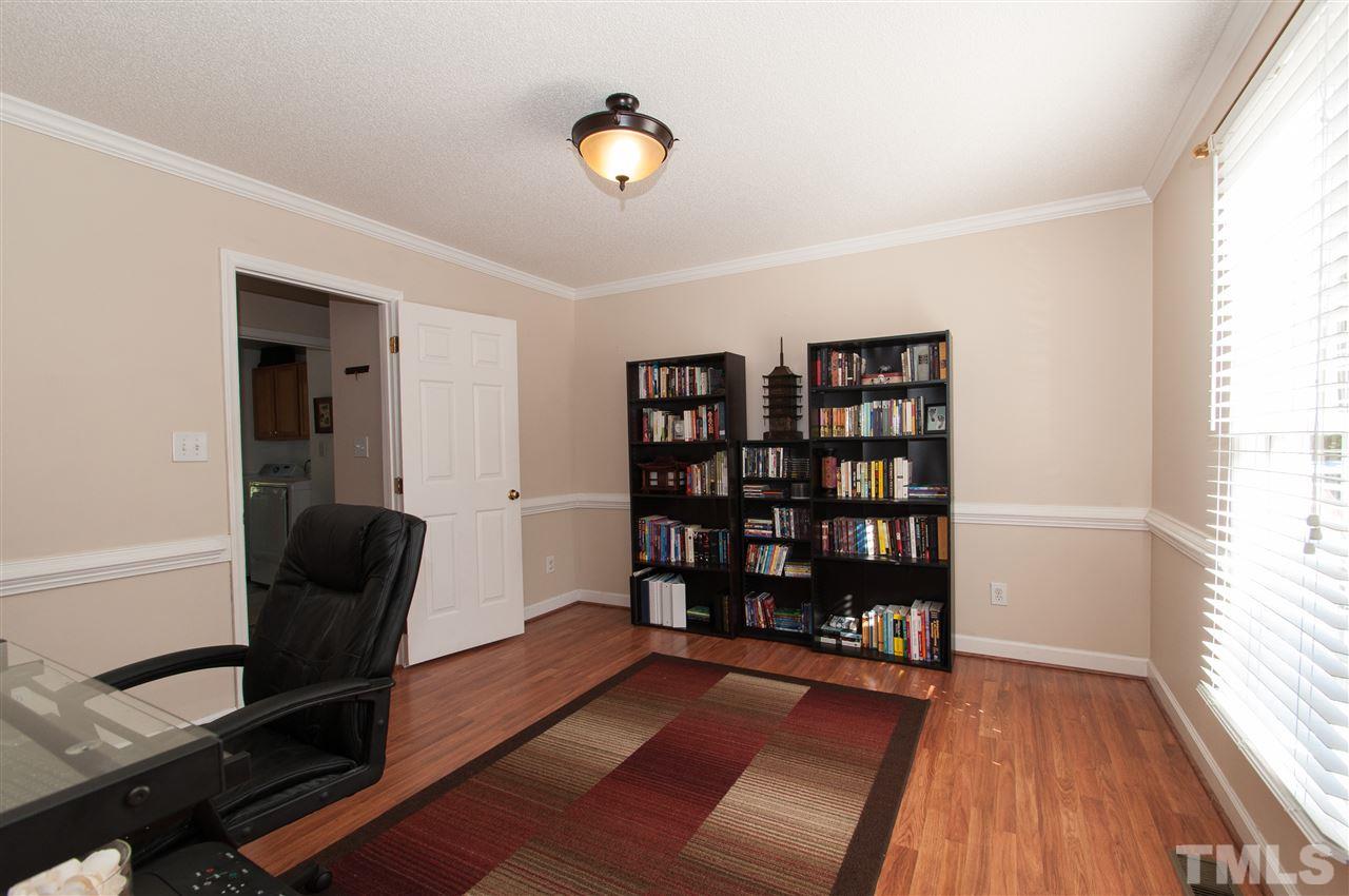 3205 Arden Branch Lane Raleigh, NC 27616 - Photo 10 of 22 a view of a hardwood floor and staircase in a room