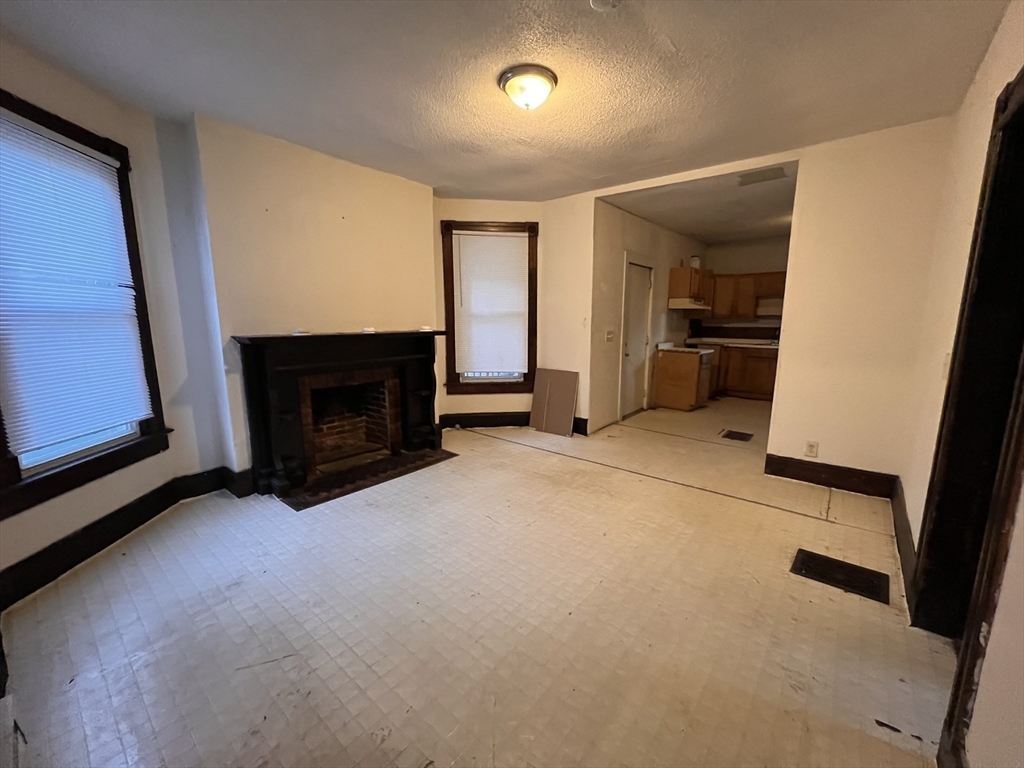 34 Wellesley Street Springfield, MA 01109 - Photo 4 of 11 a view of a livingroom with a fireplace