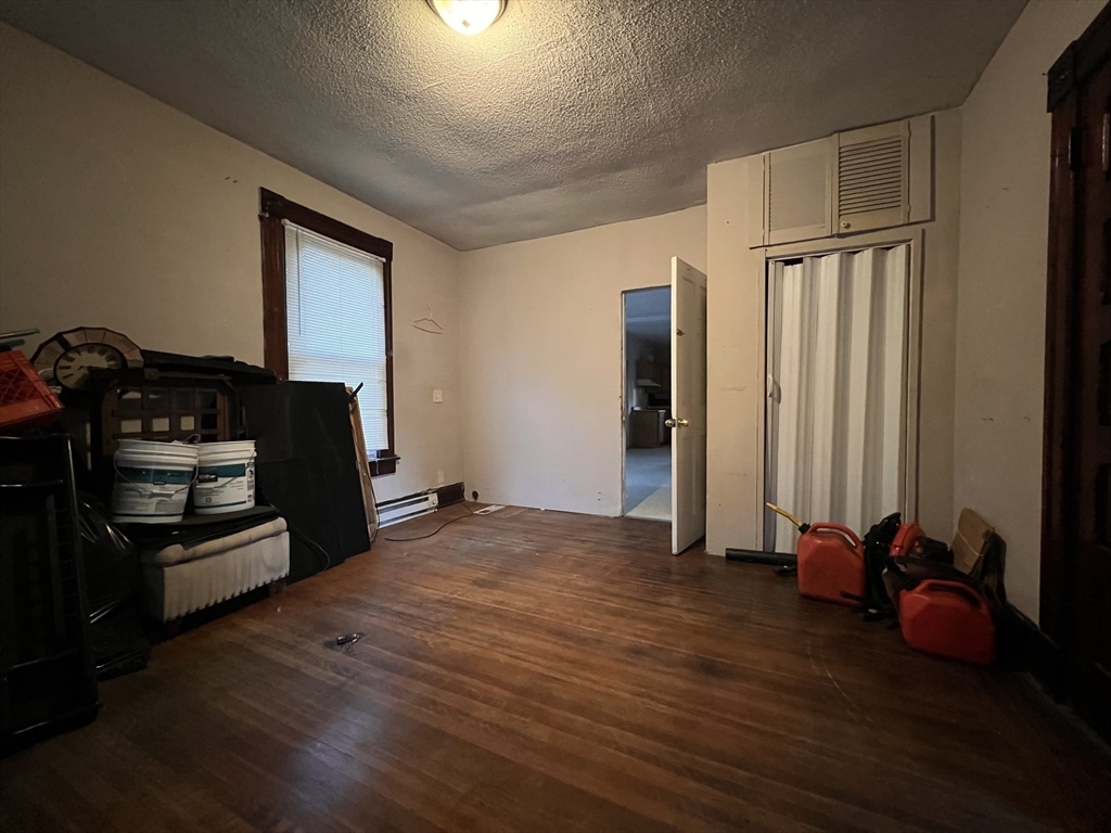 34 Wellesley Street Springfield, MA 01109 - Photo 5 of 11 a view of a livingroom with closet