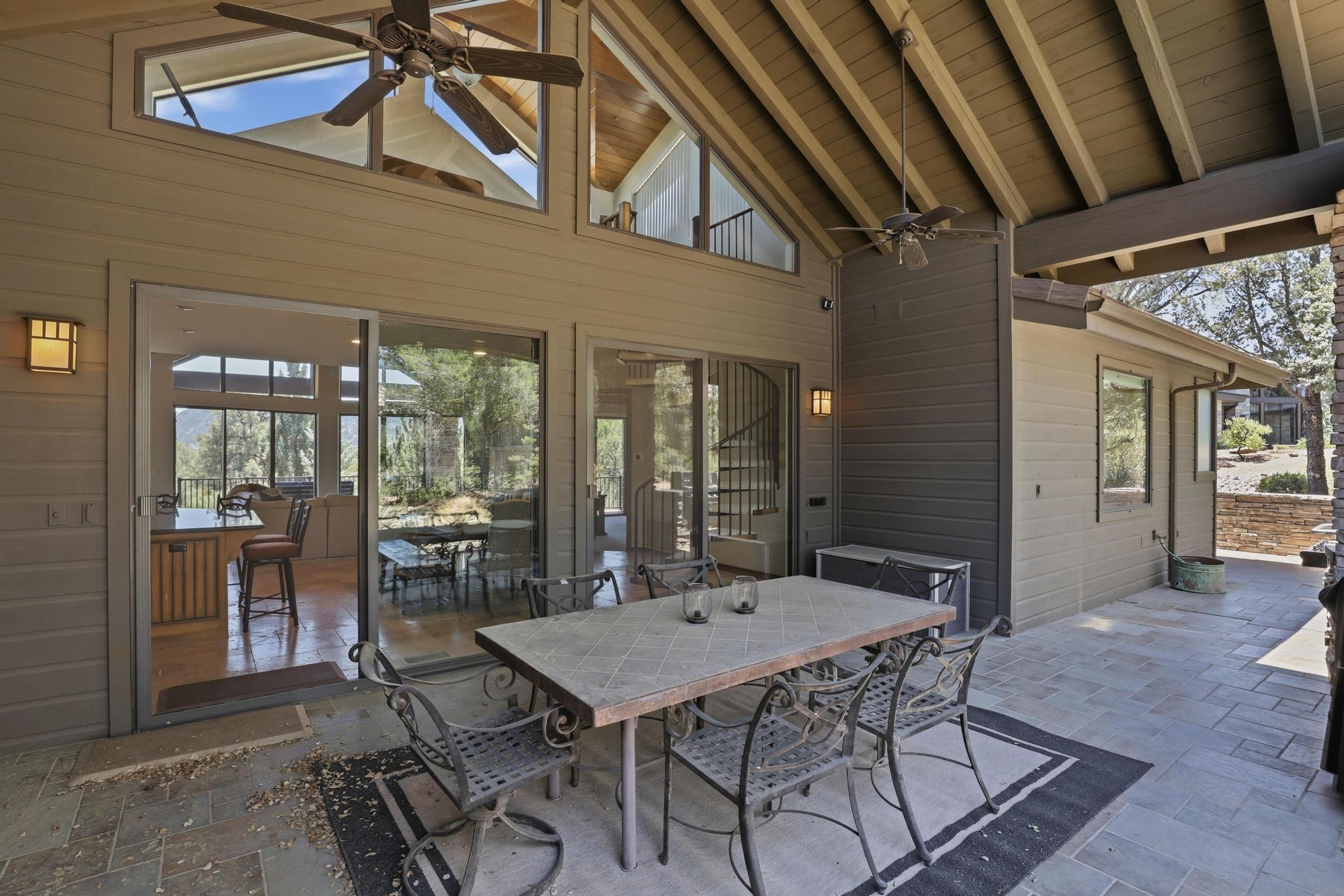 2908 East Rim Club Drive Payson, AZ 85541 - Photo 61 of 77 a view of a patio with table and chairs and potted plants