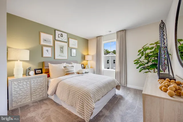 a bedroom with a bed potted plant and a window