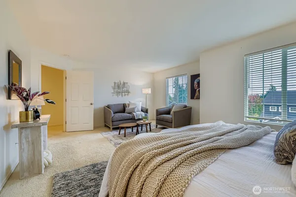 a bedroom with a bed and a couch