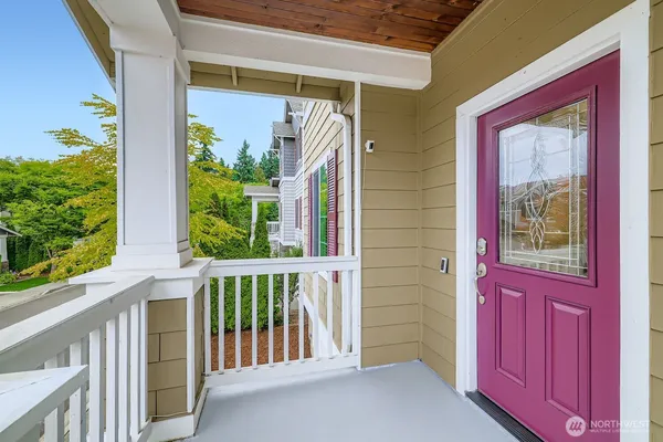 a view of a porch with a door and a porch