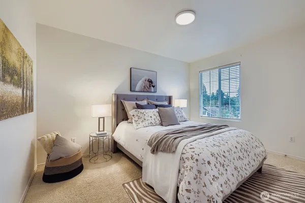 a bedroom with a bed and window