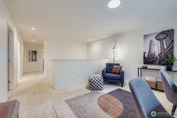 a living room with furniture and a rug