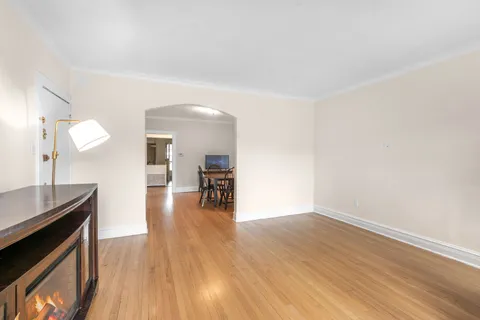 a view of a kitchen with wooden floor and a sink