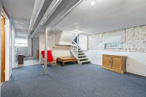 a room with furniture and white walls