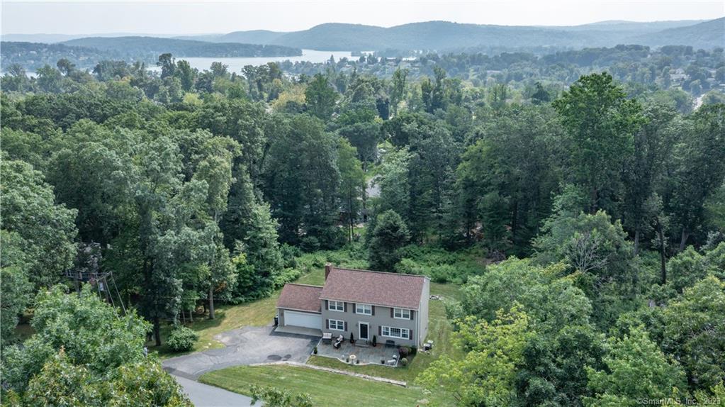 an aerial view of a house with mountain view