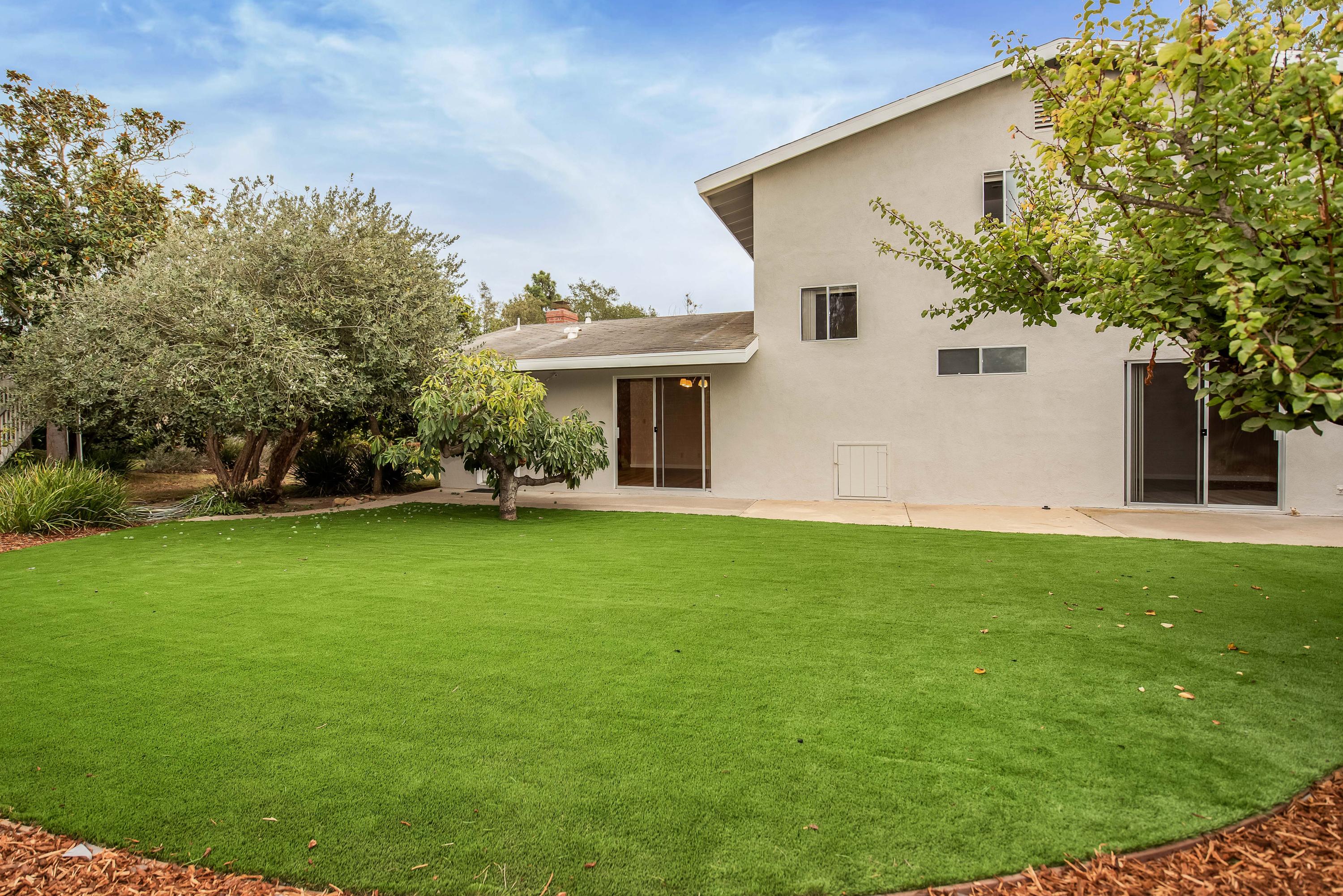 7458 Shepard Mesa Road Carpinteria, CA 93013 - Photo 16 of 17 a view of a house with a backyard